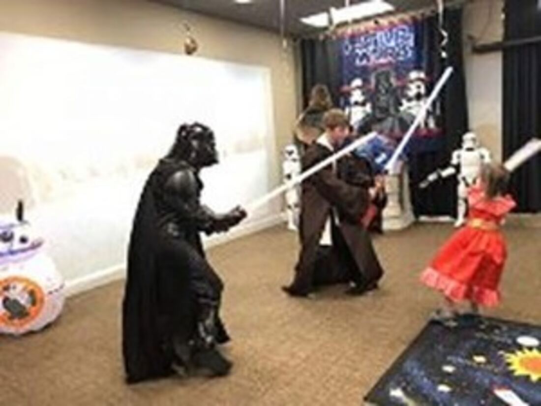 Star Wars party with lightsabers