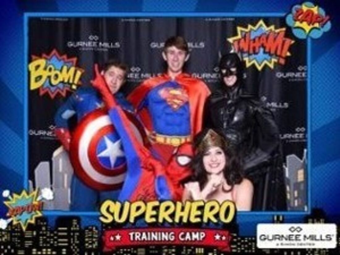 Superhero characters posing at a party